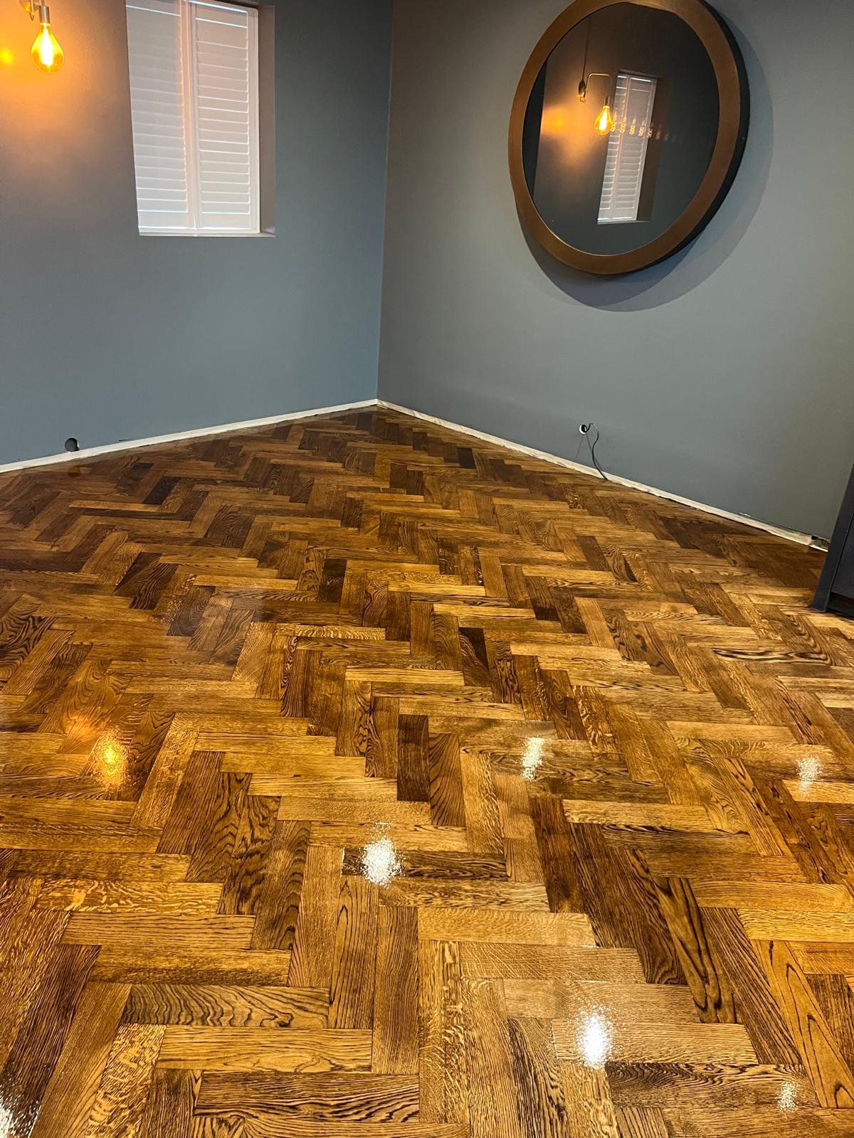 Dark stained oak herringbone floor
