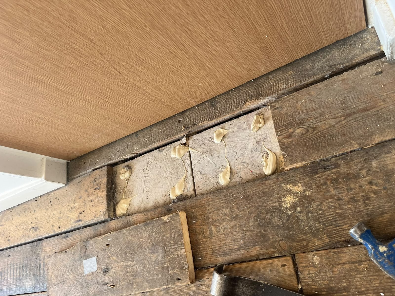 Damaged floorboards repaired before sanding