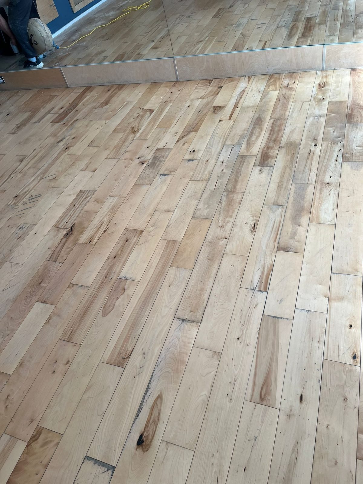Light oak floor fitted through a large room