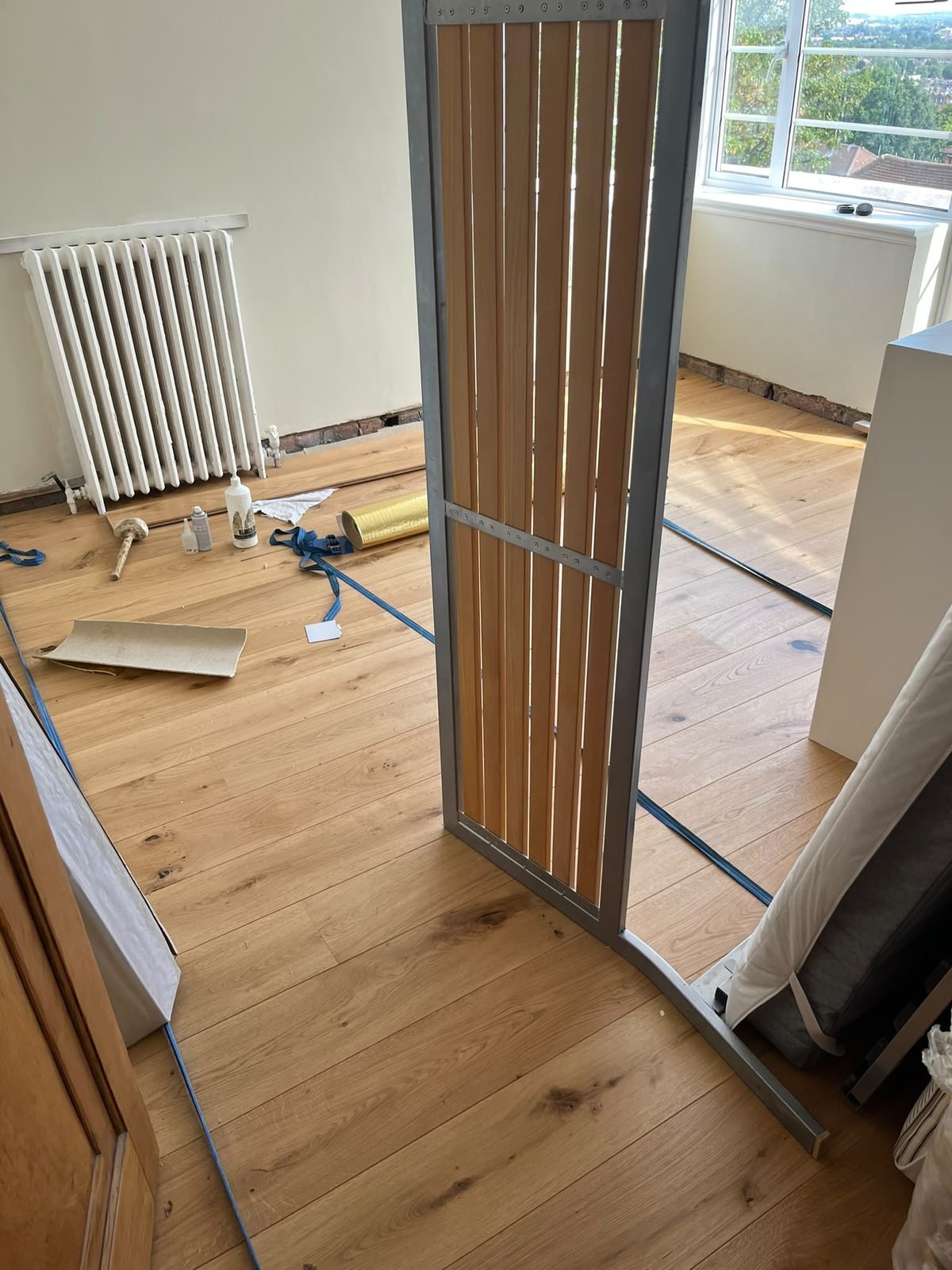 An oak floor part way through being fitted