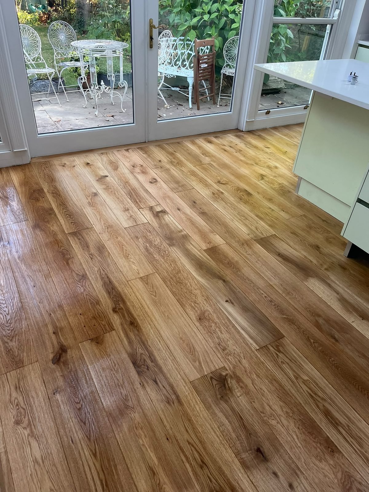 Oak floor fitted through a kitchen