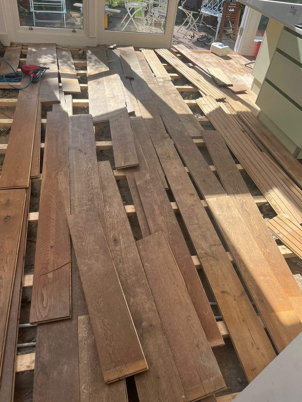 Reclaimed pine boards matched to an existing floor