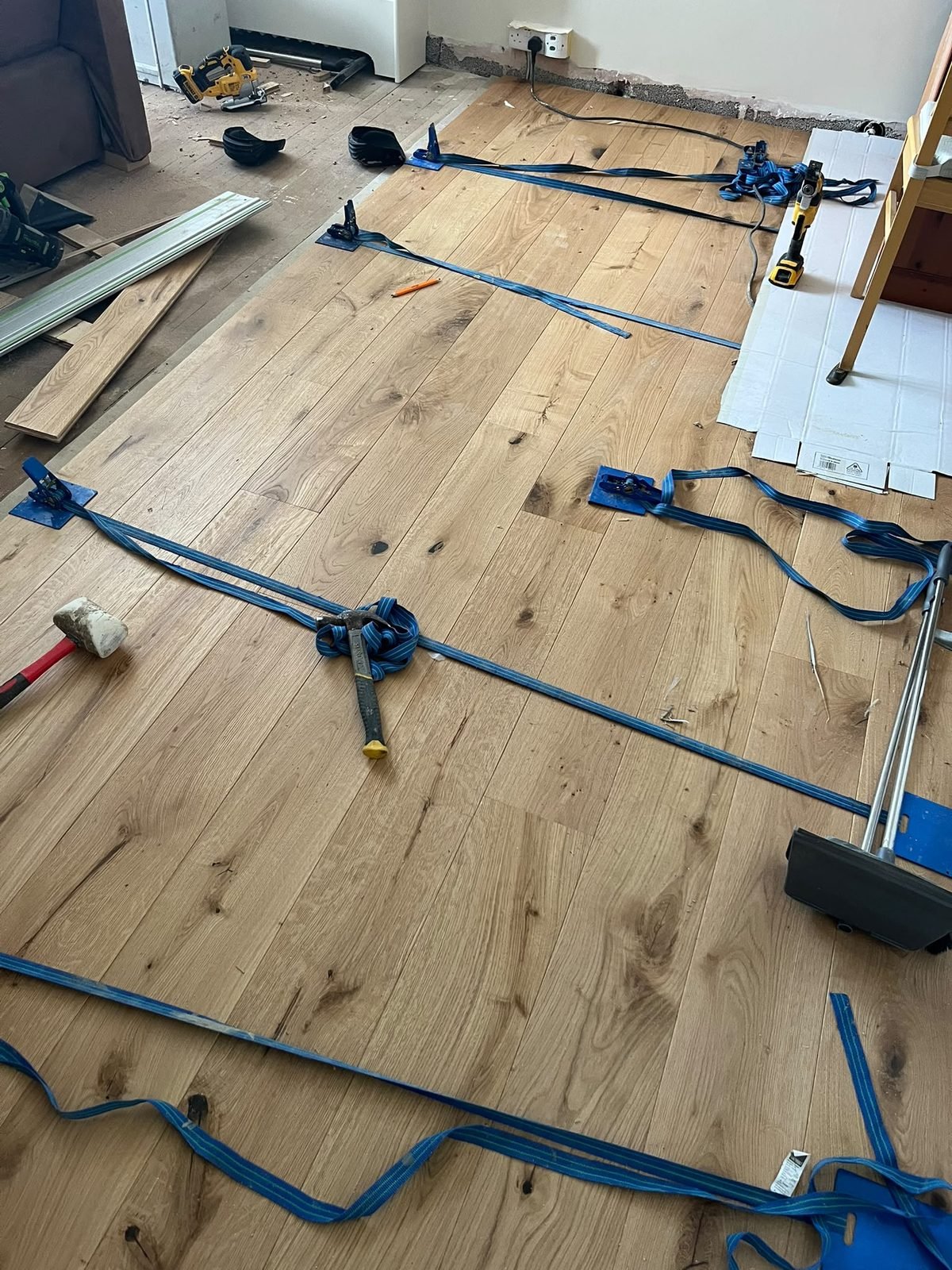 Wood floor installation in progress